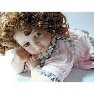 Porcelain Collectible Baby Doll 15 inches length 7 inches tall Sweet Face